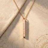 Rose gold necklace with a 'Customized' tag on a textured surface