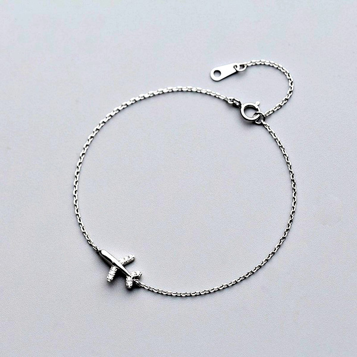 Shop sterling silver mini airplane bracelet - OurCoordinates