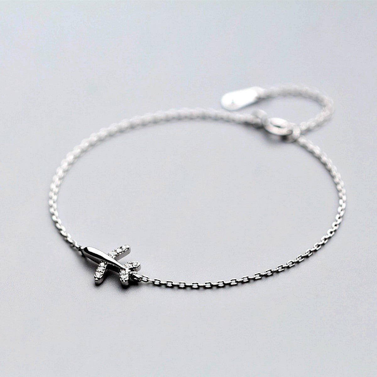 Shop sterling silver mini airplane bracelet - OurCoordinates